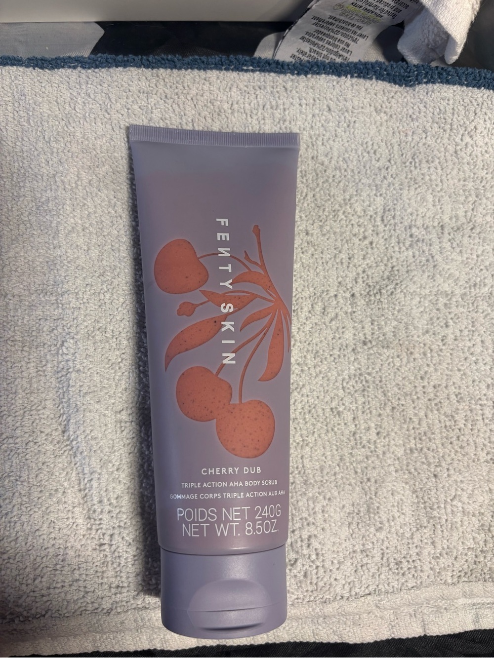 Fenty Skin Cherry Dub Body Scrub — Lavender Tube with Coral Graphic
